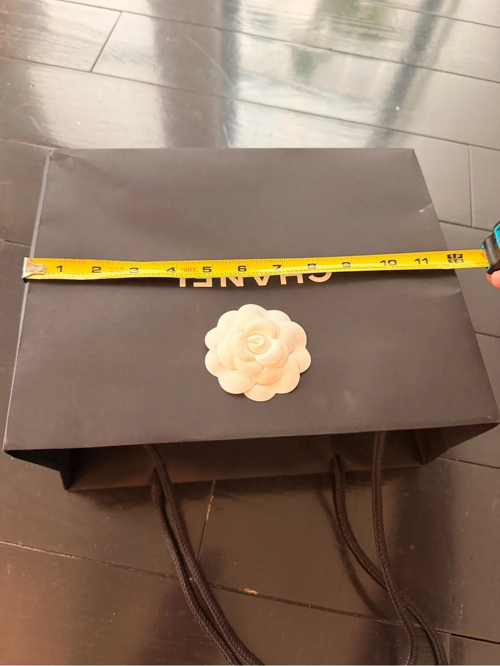 CHANEL Black bag (12” x 9”) with sticker flower accent